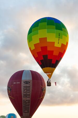 Manacor, Mallorca, Spain - October 27, 2019:  FAI European Hot Air Balloon Championship in Spain. Balloons rising up in the airのeditorial素材