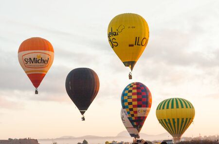 Manacor, Mallorca, Spain - October 27, 2019:  FAI European Hot Air Balloon Championship in Spain. Balloons rising up in the airのeditorial素材