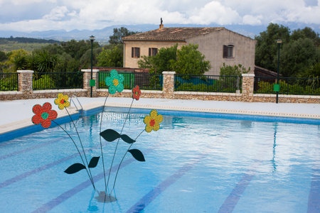 Flower decoration in the swimming pool on "Costitx en Flor" (Costitx in bloom) Flower Fair, Majorca, Spainの写真素材