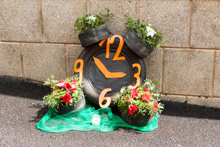 Clock made with car tires and flowers on "Costitx en Flor" (Costitx in bloom) Flower Fair, Majorca, Spainの写真素材