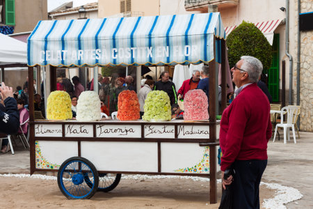 COSTITX, MAJORCA, SPAIN - MAY 1, 2018: Cart, selling artisan ice cream and decorated with flowers, at "Costitx en Flor" (Costitx in bloom) Flower Fair, Majorca, Spainのeditorial素材