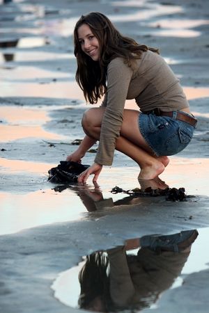 Looking for shells on the beachの写真素材