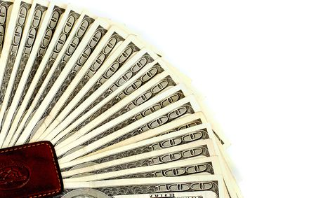 One hundred dollar bills background faned from a money clip