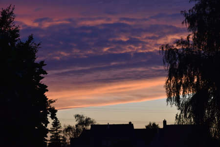 Pink and purple sky during sunsetの写真素材