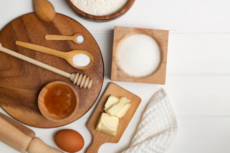 Step-by-step heart-shaped cake recipe instructions. Ingredients: butter flour sugar egg honey soda salt. Flat lay. Copy spaceの写真素材