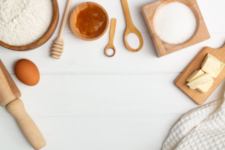 Step-by-step heart-shaped cake recipe instructions. Ingredients: butter flour sugar egg honey soda salt. Flat lay. Copy spaceの写真素材