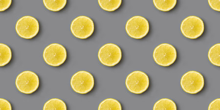 Yellow lemons on gray background seamless endless pattern. Colors of the Year 2021 Illuminating and...