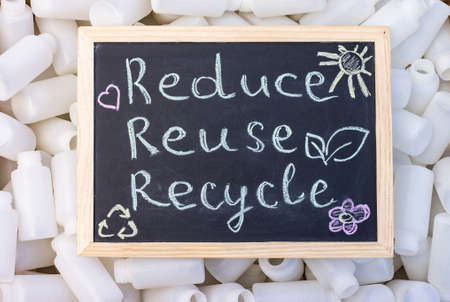 Chalk board Reduse Reuse Recycle sign on the background of empty plastic packaging. Top viewの写真素材