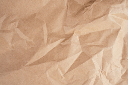 Background image of rough crumpled recycled textured kraft paper. Top view. Copy spaceの写真素材