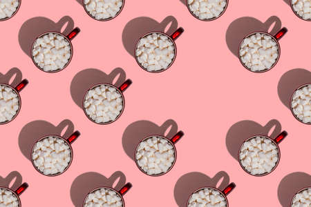Pattern of red cups with hot chocolate, coffee or cocoa with marshmallows with hard shadows isolated...