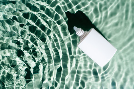 White beauty product sunscreen cream vial tube bottle in transparent fresh exhilarant wave green...
