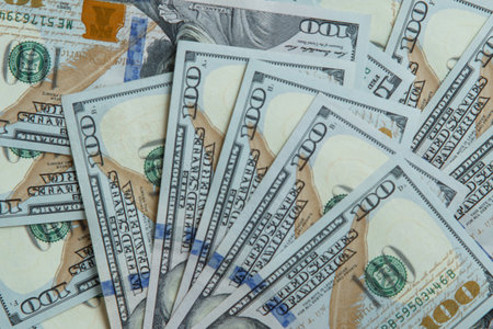 Top view of pile of one hundred 100 dollars banknotes bills. Paper banknotes, American money, cash, currency, savings, finance, banking payment, salary, background, monetary fund, business. Flat lay.の写真素材