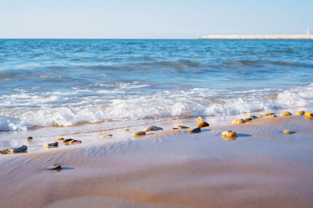 Bright blue sea waves with foam, rolling on coastal sand. Meditation and relaxation. Wonderful...