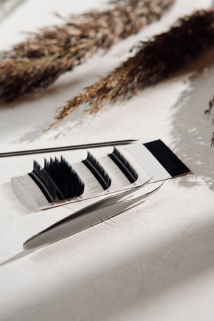 Makeup artist tools and accessories for eyelash extensions. Composition of set of eyelashes...