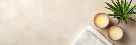 A clean top down view showcases a stylish bathroom setup featuring flickering candles a neatly folded towel and a vibrant potted plant. This serene arrangement enhances relaxation.の素材