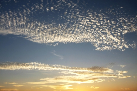 White clouds on a blue sky orangeの写真素材