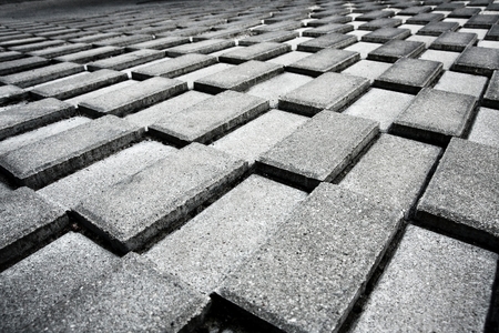 Concrete bricks arranged one above the other below the driveway