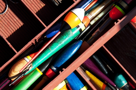 floats and other fishing accessories in a special containerの写真素材