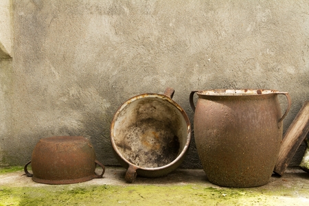 four old ceramic pottery including one tied with stringの写真素材