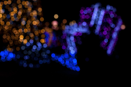 blurry lights Christmas tree with great outlines of silhouettes congruent in front of her peopleの写真素材