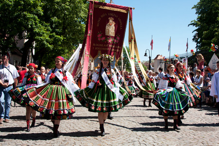 Lowicz, Poland - June 04.2015: procession in folk costumes during the celebration of Corpus Christi