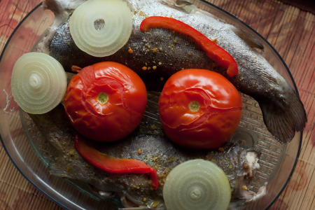 Steamed trout with tomatoes, onions and red peppers, healthy and tastyの写真素材