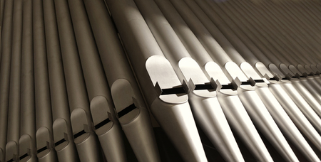 part of the church organ with many air pipes made of metalの写真素材