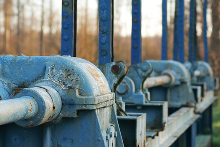 blue-floated mechanisms for lowering and lifting water barriersの写真素材