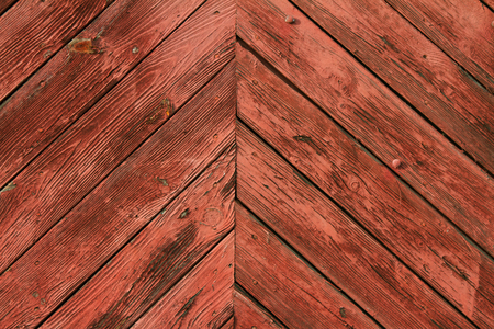 painted in red, weathered wooden sun, solid and strong doorの写真素材