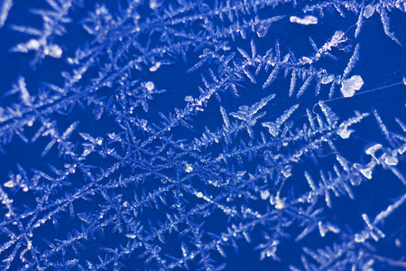 natural crystals, snowflakes lying on a blue background