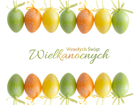 Wooden rabbit with beads around neck and single green, colorful egg - Easter eggの写真素材