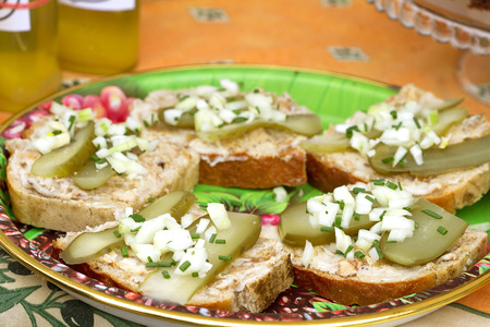 Sandwiches with lard, cucumber, sprinkled with onion and chives in a street stallの写真素材