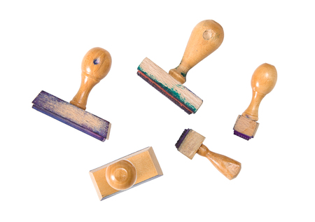 Several used stamps, stained in ink on a white backgroundの写真素材