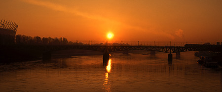 Panorama of Warsaw with a railway bridge over the WisÅa River and a sports stadiumの写真素材
