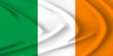 The Ireland flag waving from the wind, proudly fluttering in the windの写真素材