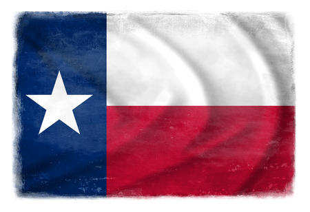The Texas flag waving from the wind, proudly fluttering in the wind with traces of use in battle and destruction from difficult warfareの写真素材