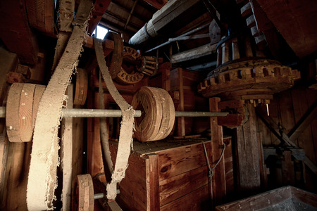 The original, wooden mechanism of an old windmill, grain millの写真素材