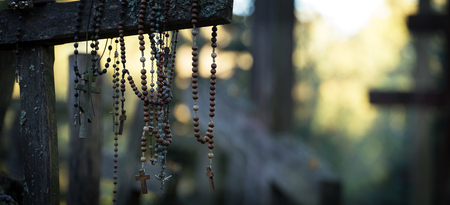 Small crosses hanging on the shoulders of a large cross on the holy mountain of Grabarkaの写真素材