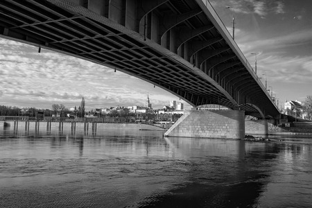 Warsaw - a bridge over the Vistula river with a panorama of the coastal city - photo in black and whiteの写真素材