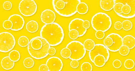 Background of yellow, large lemons filling tightly the entire surfaceの写真素材