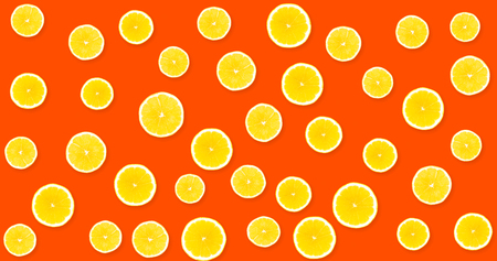 Background with yellow lemons on a red, strawberry backgroundの写真素材
