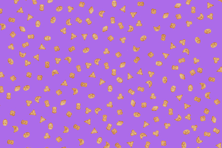 Small cookies, crackers of various shapes on a purple backgroundの写真素材