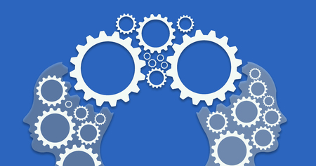 Two heads profiles connected by large machine cogwheel on a blue backgroundの写真素材