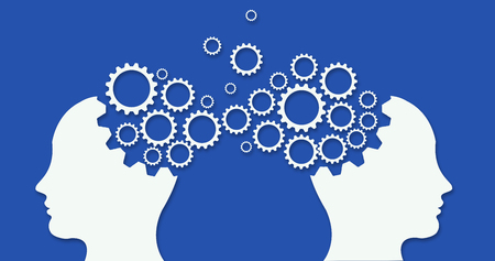 Two heads profiles connected by large machine cogwheel on a blue backgroundの写真素材