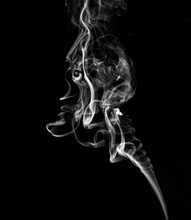 White, twisted smoke on a black backgroundの写真素材