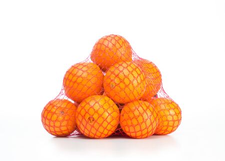 Fresh, appetizing oranges in a grid on a white backgroundの写真素材
