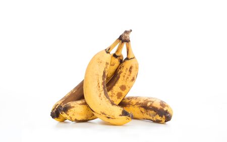 Kise of old, broken banana photographed on a white backgroundの写真素材