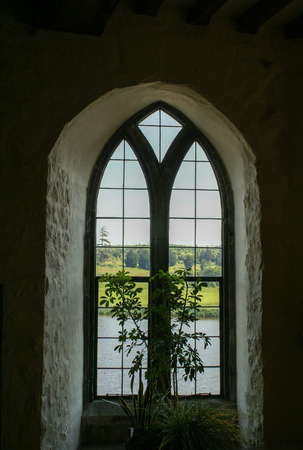 Interior of the bedroom with a window looking outの写真素材