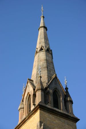 Church spire with blue sky background