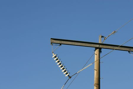 A 132kV powerline with crossarm and disc insulator string.